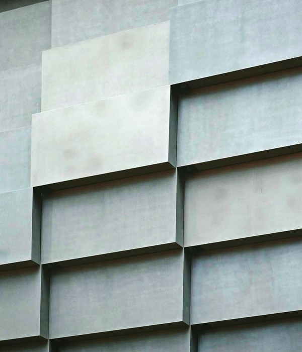 Close-up of a modern geometric architectural wall with raised patterns.